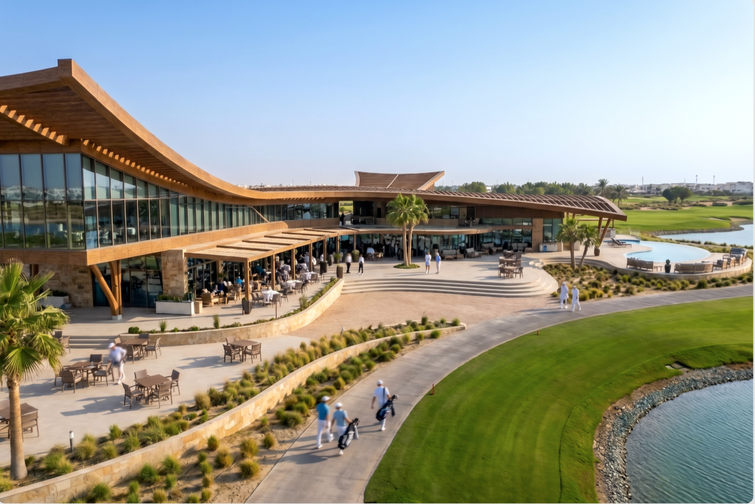 The Greens — wide side view of the clubhouse showing the curved wooden roof running the length of the building along the course