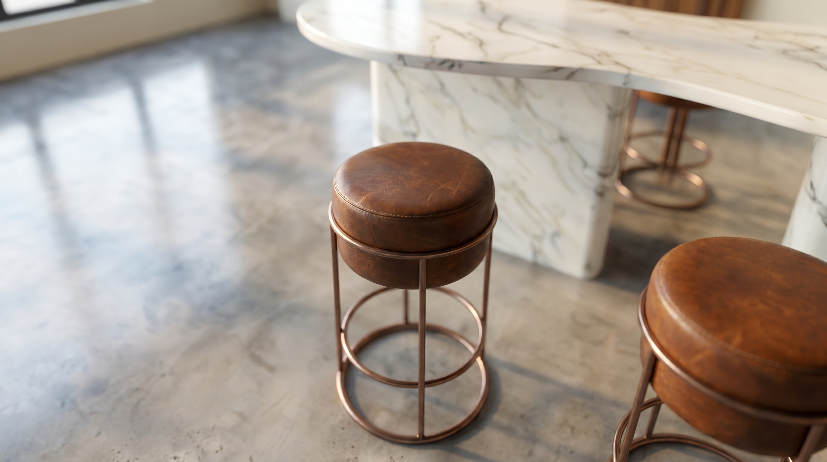 YOM — material close-up of a rust leather bar stool beside the marble bar